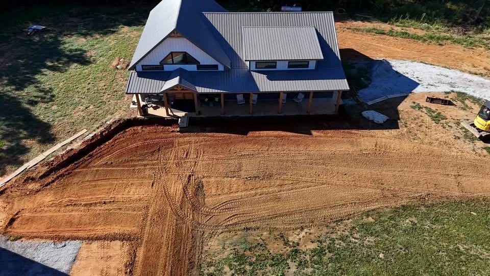 Aerial view of a residential site during deliberate grading and preparation
